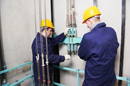 two people working for lift maintenance