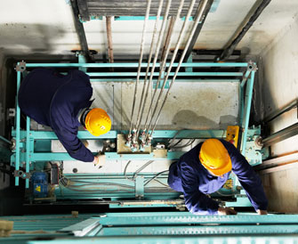 two people working for lift maintenance